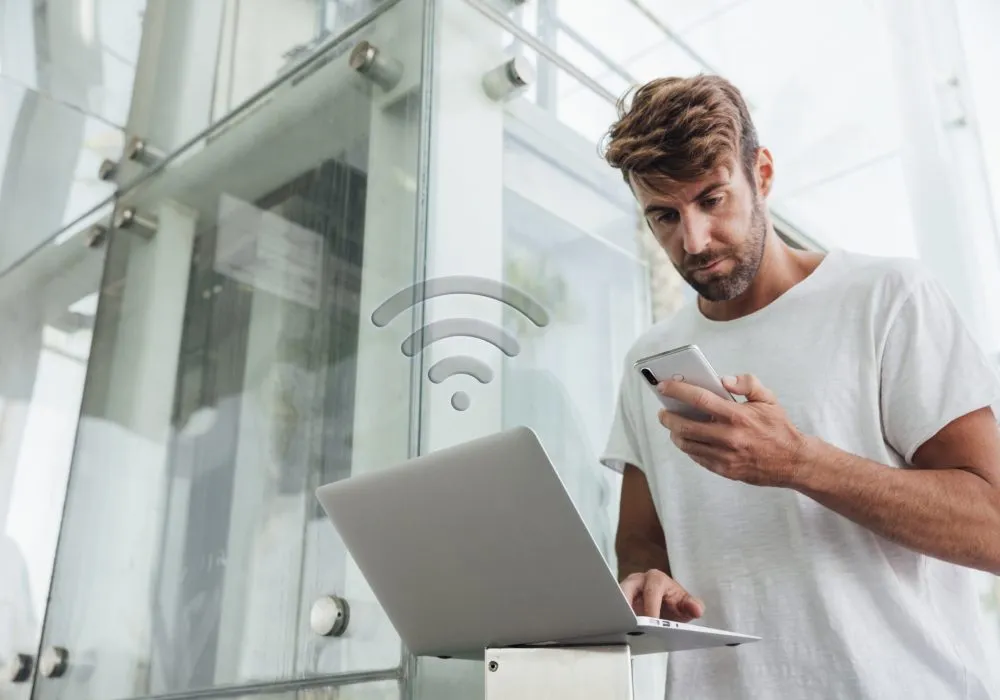 bearded-man-checking-portable-devices