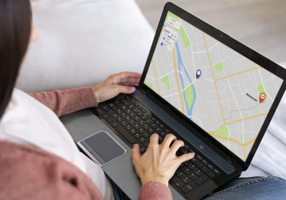 high-angle-woman-holding-laptop