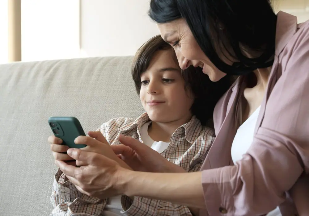 mother-son-looking-together-smartphone